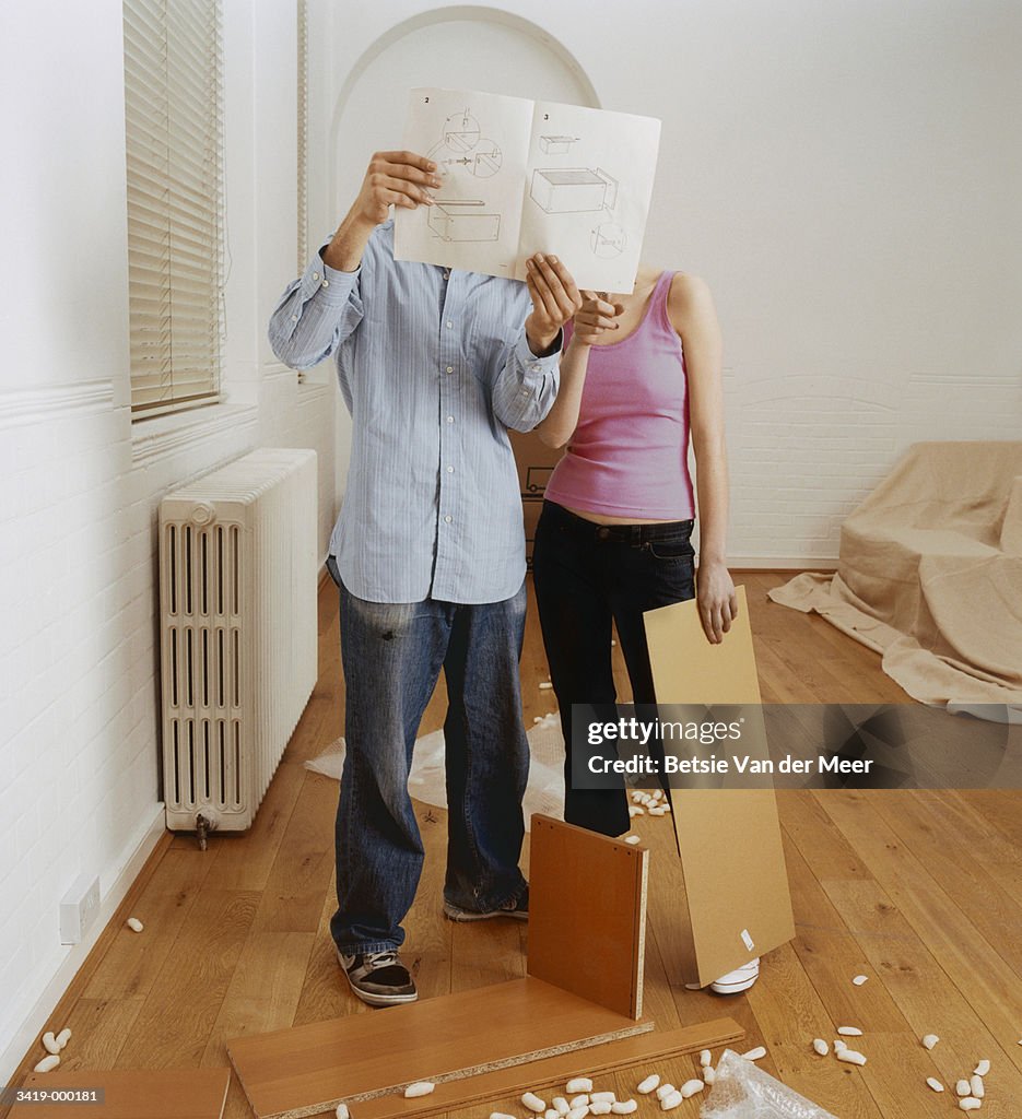 Couple Looking at Manual