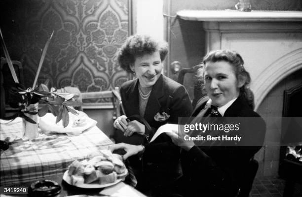 Two Polish women chatting in their new home in Britain. The Polish government is attempting to lure its immigrants back to Poland, but few are likely...