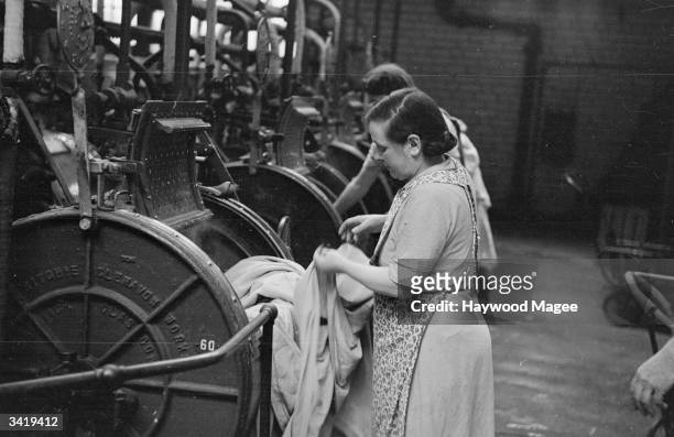 People of Glasgow bring their laundry to the Corporation wash-house, which costs fourpence an hour. Many Glaswegian housewives do their laundry at a...