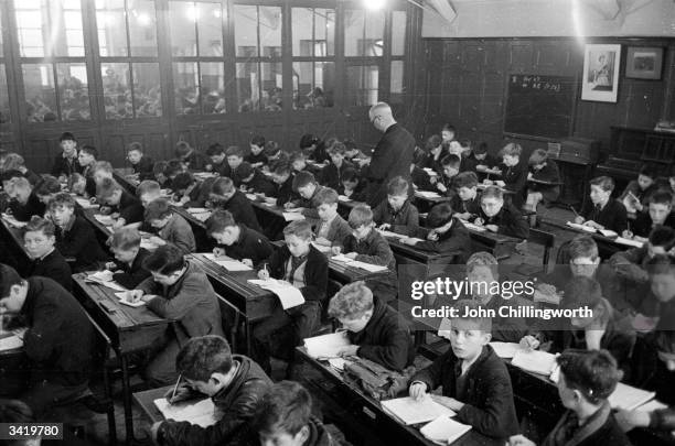 Crowded classroom where 248 children are taught at once in a Belfast school. Original Publication: Picture Post - 7029 - The Best And The Worst Of...