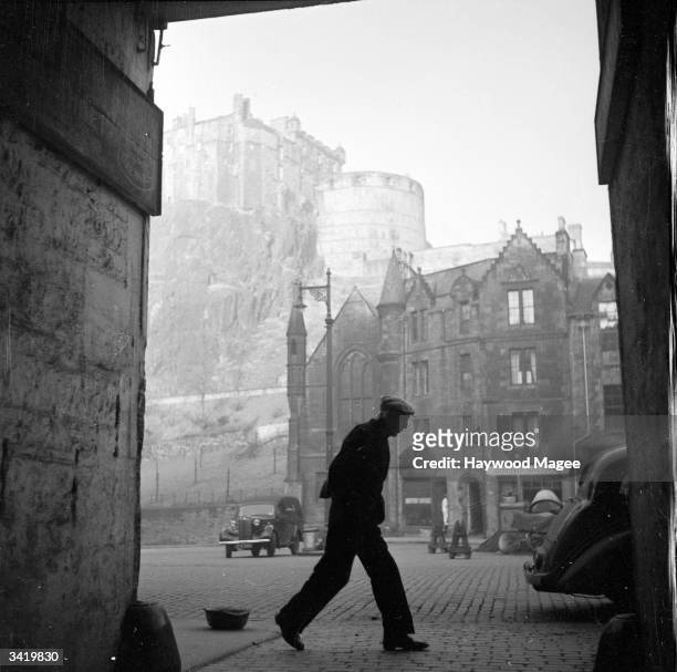 Street scene in the old town of Edinburgh with the castle in the background. There is evidence of Iron Age settlement in Edinburgh and the old part...
