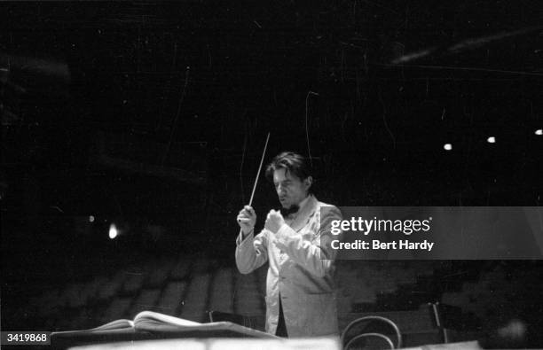 John Barbirolli conducting the Halle orchestra. Original Publication: Picture Post - 6416 - Orchestra Under Notice - pub. 1953