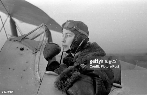 The British actress Valerie Hobson in a Tiger Moth aeroplane during a flying lesson. Original Publication: Picture Post - 4490 - Valerie Hobson...