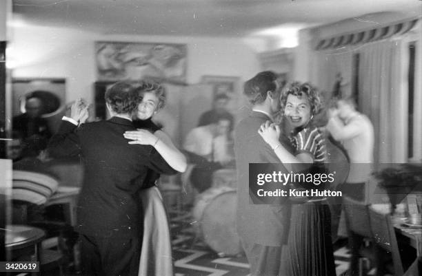 Couples dancing in a cafe in France. Original Publication: Picture Post - 7160 - Honeymoon - pub. 1954