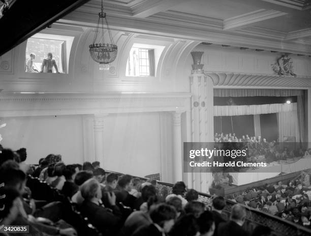 Looking in from an open window Mrs Herbert Morrison listens to her husband speak at the Labour Party conference in Margate