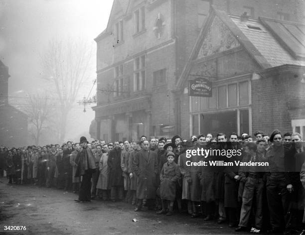 Part of the queue outside Tottenham's ground for the football match between Arsenal and Dynamo Moscow.