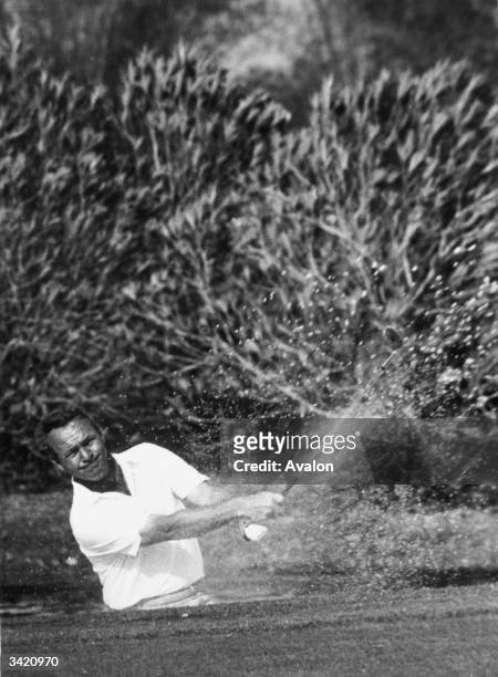 Arnold Palmer battles to get out of a bunker at the Doral_Eastern Open Golf Championship at Miami. He finished 27th.