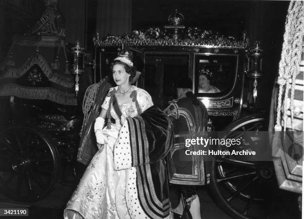 Princess Margaret Rose getting out of a state coach after attending the coronation of her sister, Queen Elizabeth II. Queen Elizabeth The Queen...