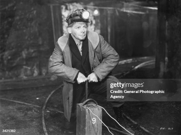 Paul Muni as a miner in a scene from the Warner Brothers film 'Black Fury', a social drama about mining and the unions, directed by Michael Curtiz.