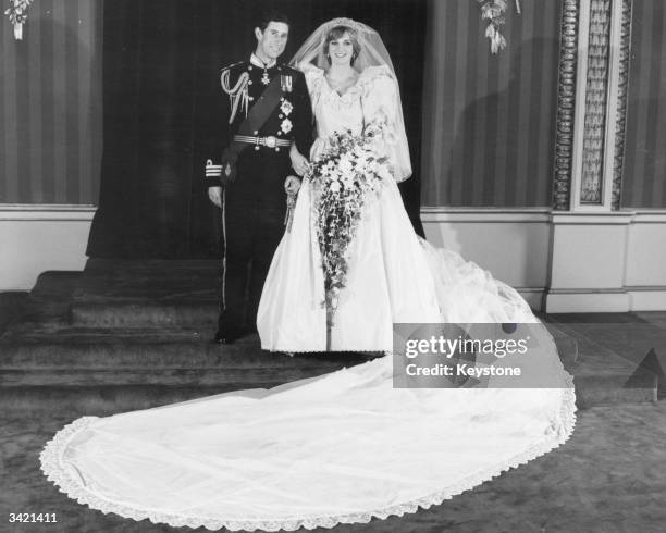 Charles, Prince of Wales and Diana, Princess of Wales in the throne room of Buckingham Palace, after their wedding at St Paul's Cathedral, London.