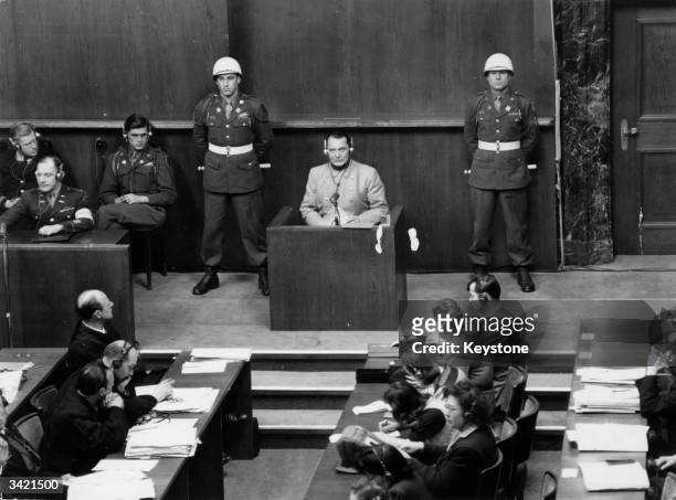 Nazi leader Hermann Goering in the witness box at the Nuremberg War Crime Trials, where he was later sentenced to death.