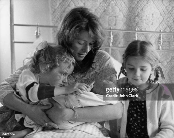 Film actress Vanessa Redgrave at her Chiswick home, with her two daughters Natasha and Joely Kim, and her newborn son Carlo Gabriel.