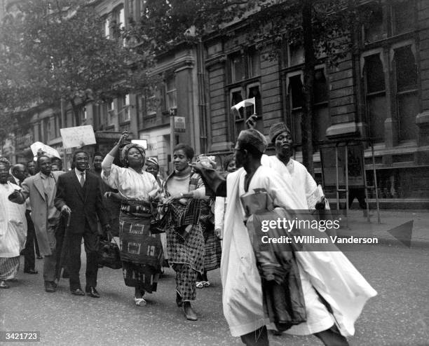 Nigerian students celebrating independence outside Nigeria House in London.