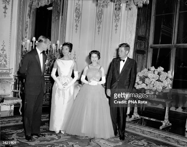 Prince Philip, Jacqueline Kennedy , Queen Elizabeth II of Great Britain and the American President John Fitzgerald Kennedy at Buckingham Palace,...
