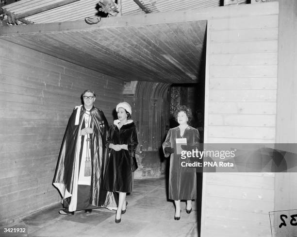 The Reverend Robert Wylmer Woods, the Dean of Windsor, with Queen Elizabeth II and Queen Elizabeth The Queen Mother outside St George's Chapel,...