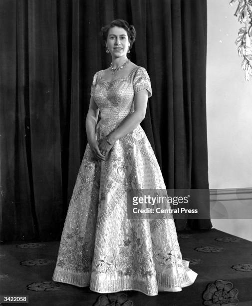 Queen Elizabeth II wearing a gown designed by Norman Hartnell for her Coronation ceremony.