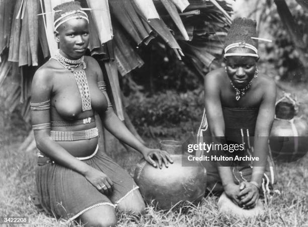 Women from a Zulu tribe preparing a meal.