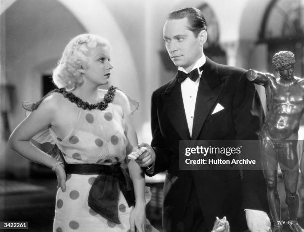 American leading lady Jean Harlow with Franchot Tone in a scene from the film 'Born To Be Kissed' , directed by Jack Conway and Sam Wood for MGM.