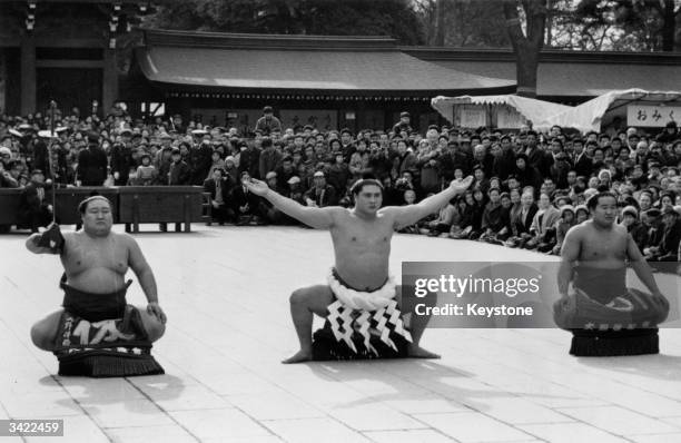 Sumo Grand Champion Taiho performing the ritual of Dohyoiri at Meiji Shinto shrine in Tokyo at an annual ceremony of homage. Left to right -...