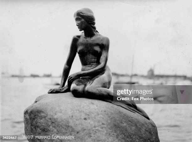 Statue in Copenhagen harbour based on Hans Christian Andersen's tale of the Little Mermaid.