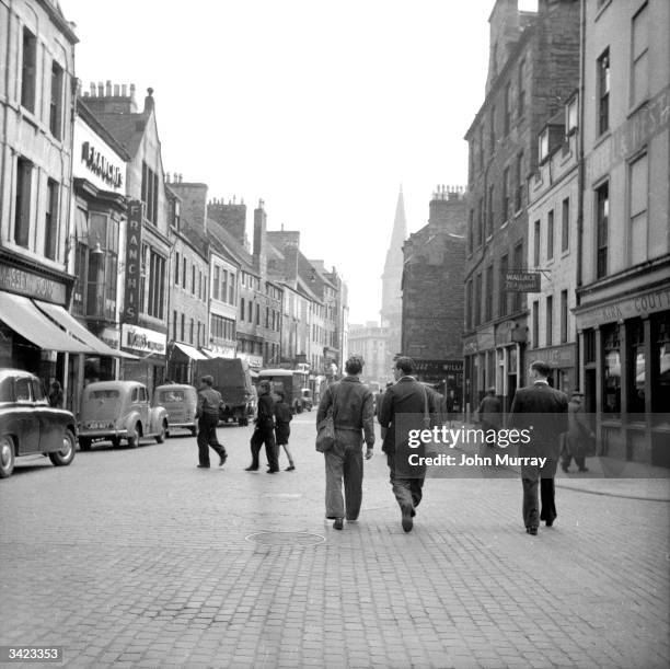 Street of shops in the Scottish city of Dundee. Dundee, situated on the banks of the dSilvery Tayf, is linked to Fife and the south of Scotland by a...