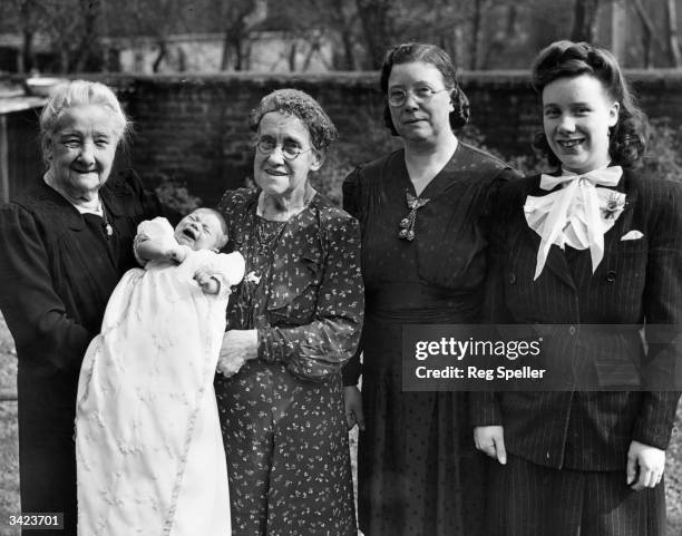 Five generations of the Smith family from North London.On the left is great great grandmother Eliza Smith holding new baby Raymond with her daughter,...