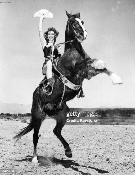 Maureen Smith shows how to ride a rearing horse in the holiday resort of Las Vegas, Nevada.