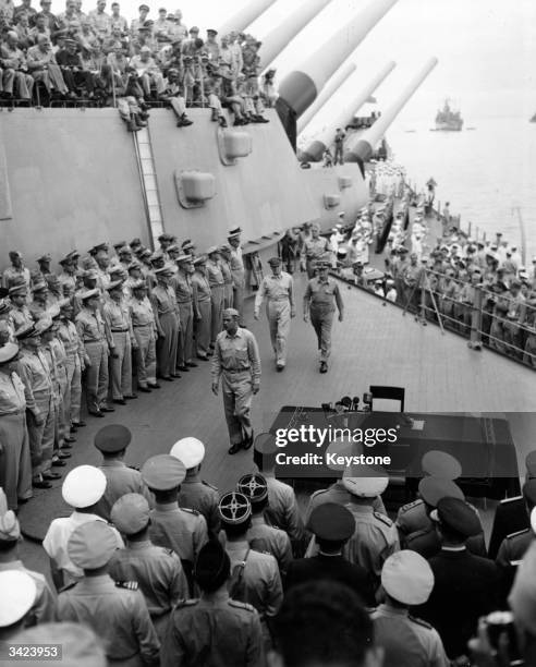 Supreme Commander for the Allies, Douglas MacArthur , accompanied by Fleet Admiral Chester William Nimitz , arrives on board the USS Missouri, in...