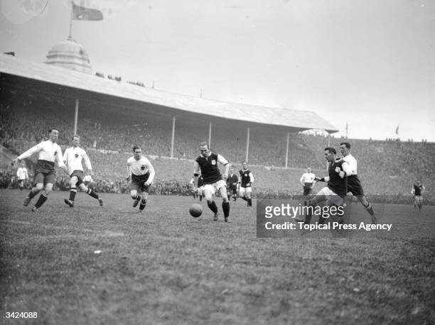 West Ham United's Moore receives a pass from team mate, Ruffell in the first ever FA Cup final to be played at Wembley Stadium. West Ham United went...