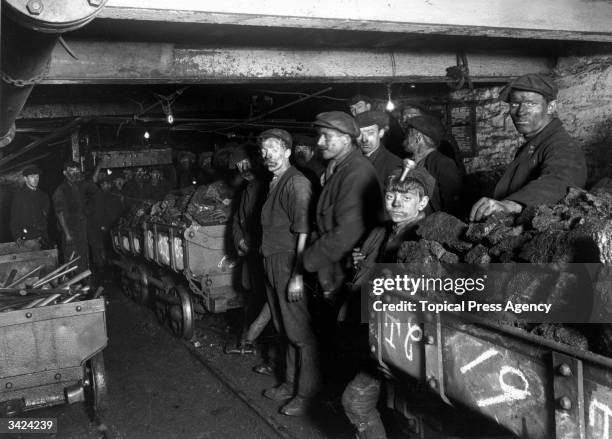 Miners in the pits at Bargoed, near Cardiff, waiting to go up to the surface.