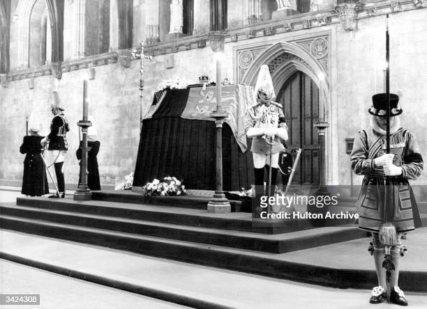 The coffin of King George VI of Great Britain at Westminster Hall guarded by Horse Guards and Beefeaters.