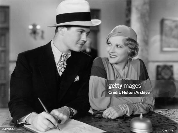 Richard Barthelmess the Americal leading man and Sally Eilers the American leading lady are in a hotel reception in a scene from the film 'Central...