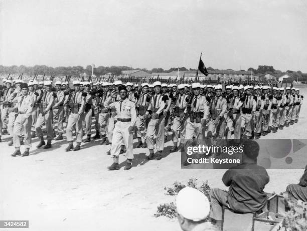 Tunisian Zouaves, part of the French Foreign Legion, march past at a military display held in Vincennes to celebrate the centenary of the Medaille...