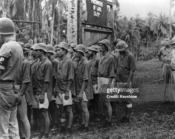 American marines taking Japanese prisoners of war away from the Solomon Islands as the army takes control.