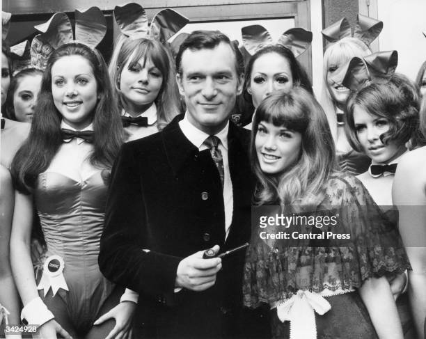 Hugh Hefner, head of the Playboy Clubs on a visit to his London club in Park Lane, London. With him is his 19 year old girl friend Barbara Benton and...