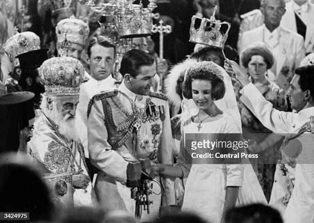 King Constantine of Greece and Princess Anne-Marie of Denmark during their wedding in Athens Cathedral. The service was conducted by Archbishop...