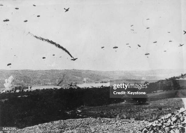 German parachutists drop onto Crete during the invasion of Greece.