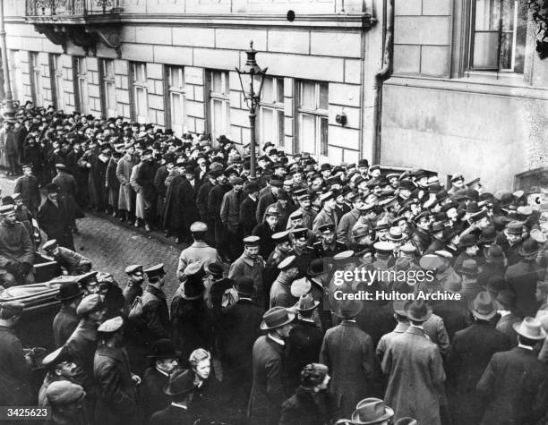 Germans queuing to make inquiries at the District Commission in Cologne.