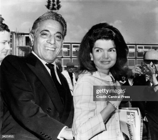 Millionaire shipping magnate Aristotle Onassis with his wife Jackie .