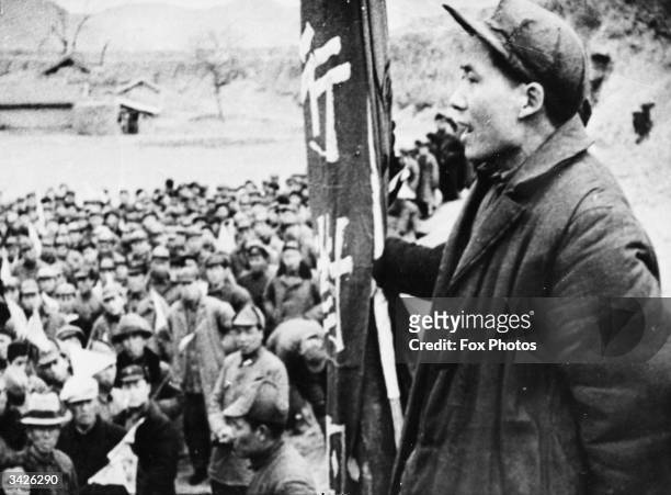Chinese communist guerrilla leader Mao Tse-Tung, the future President of communist China and chairman of the Communist Party, addressing a meeting.