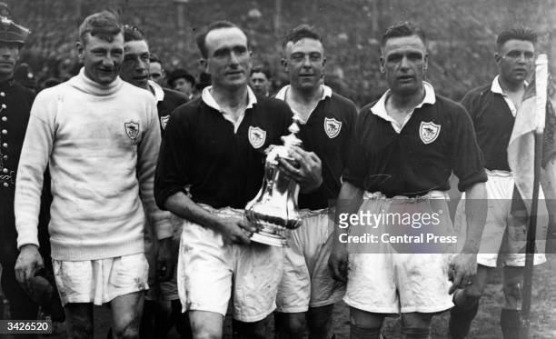 Arsenal captain Tom Parker holding the FA Cup after beating Huddersfield 2-0 at Wembley.