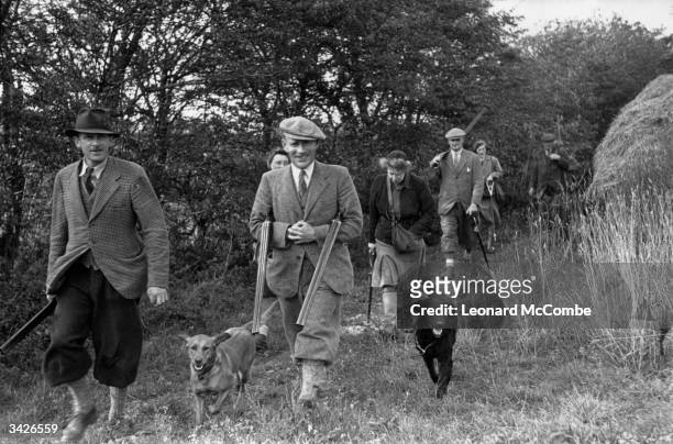 Group of farmers on a shoot in Norfolk. Original Publication: Picture Post - 1570 - A Norfolk Farmers' Shoot - pub. 1943
