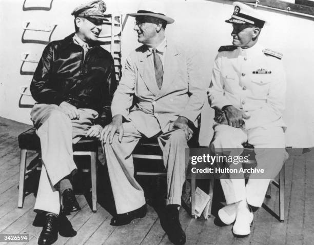 President Roosevelt and General MacArthur in relaxed mood.