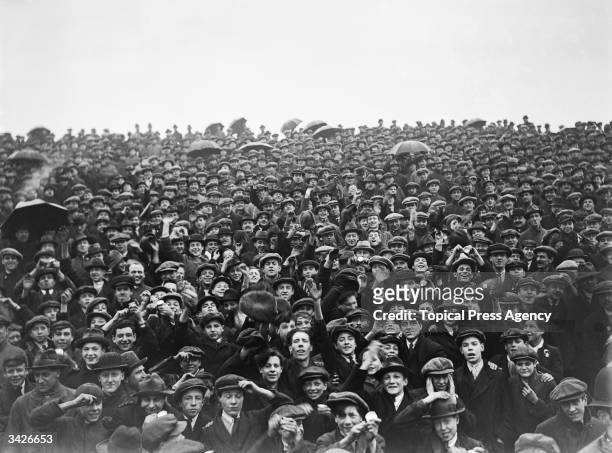 Section of the crowd at the football match between Arsenal and Preston North End at Arsenal's stadium in Highbury, North London.