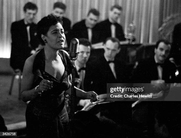 American jazz singer Billie Holiday , also known as 'Lady Day', during a performance. Original Publication: Picture Post - 7380 - Billie Holiday -...