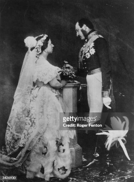Queen Victoria and Prince Albert in a re-enactment of their marriage ceremony. Prince Albert is in military uniform and is wearing his medals.
