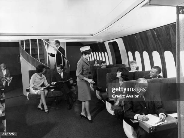 Demonstration of the new Boeing 747 passenger plane under development. Due for completion in 1969, the craft is so large it includes a stairway...