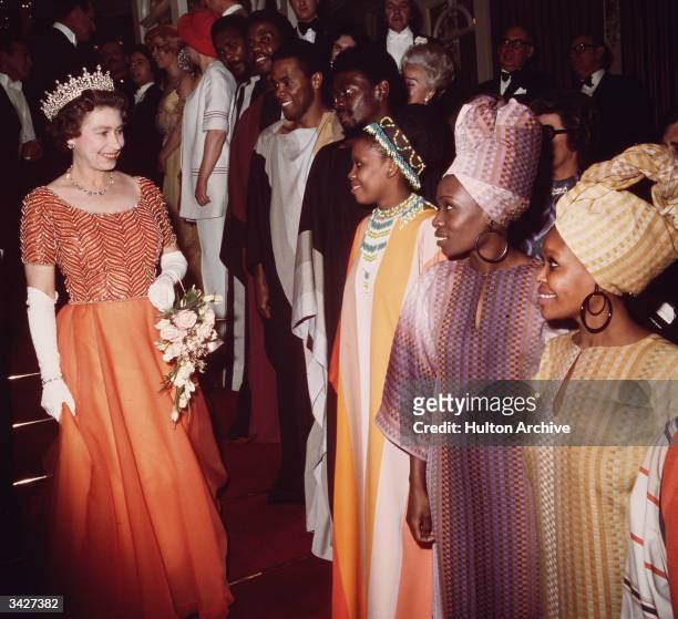 Queen Elizabeth II meeting members of the Kwa Zulu Dance Company after a Royal Variety Performance at the London Palladium.