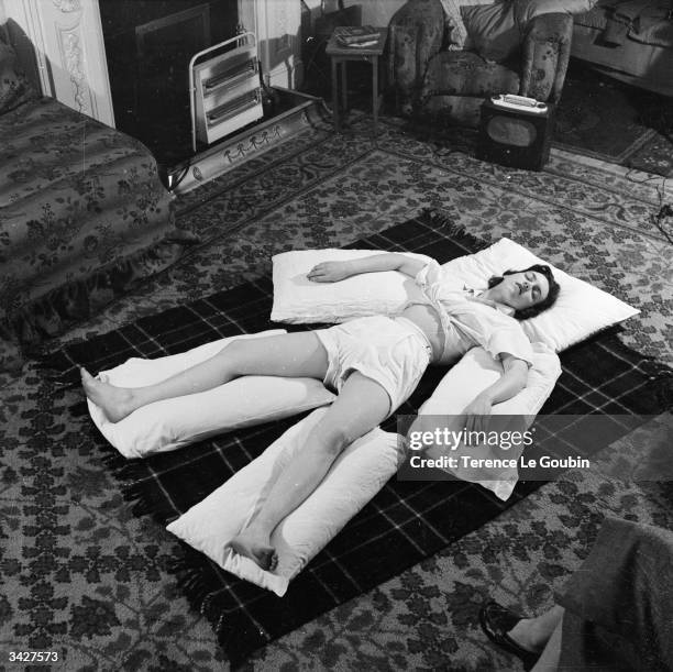 Student at a London hospital learns how to fully relax under the tuition of Mary Phillips of the Chartered Society of Physiotherapists.