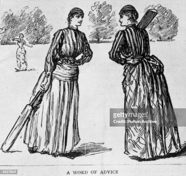 Participants in a ladies cricket match between Harrow and Pinner, played in the Harrow School grounds, stop for a 'consultation'. Original Artist -...